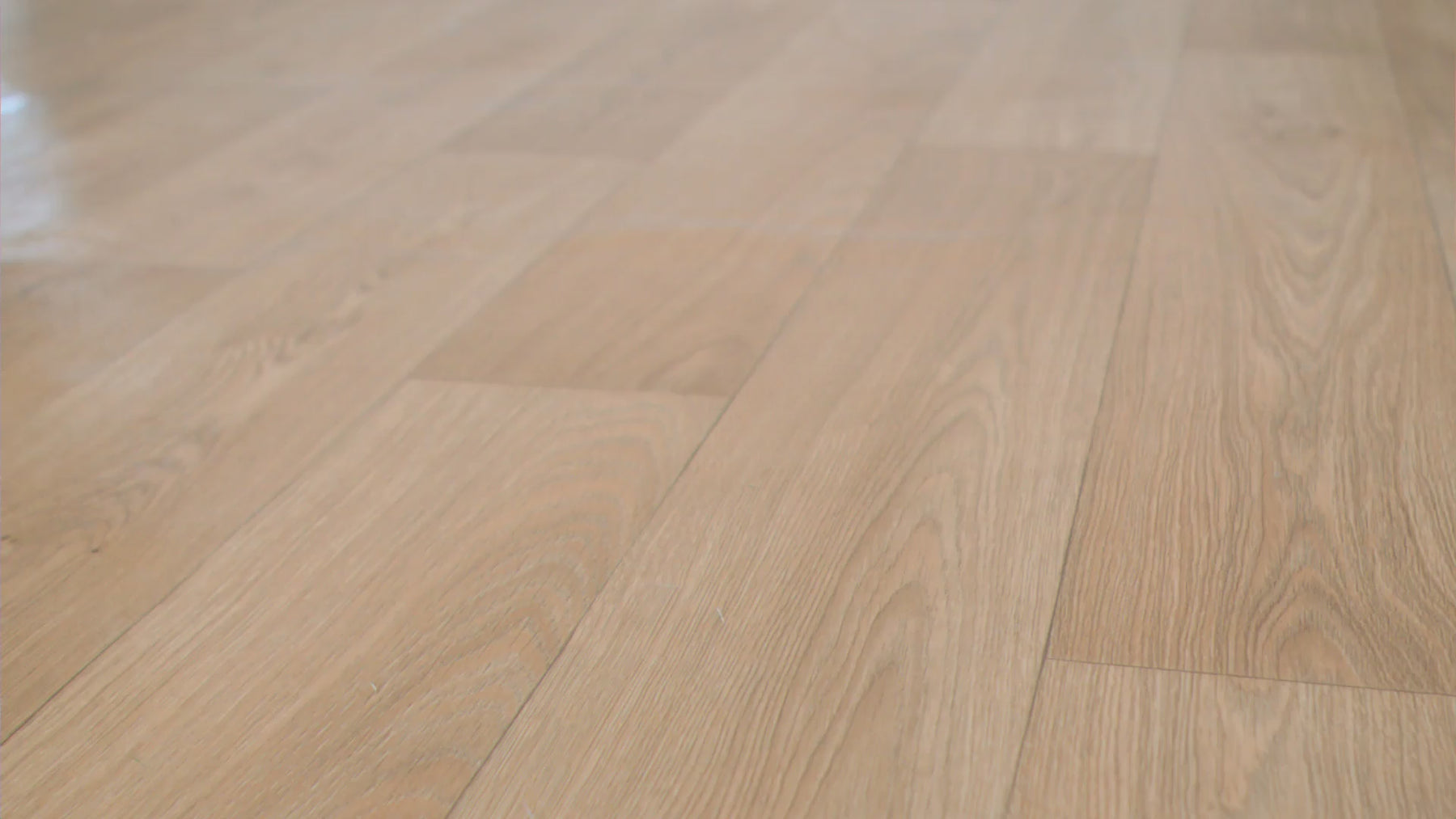 Video demonstrating EcoDense hybrid resilient flooring with liquid spilled on the surface to show waterproof performance